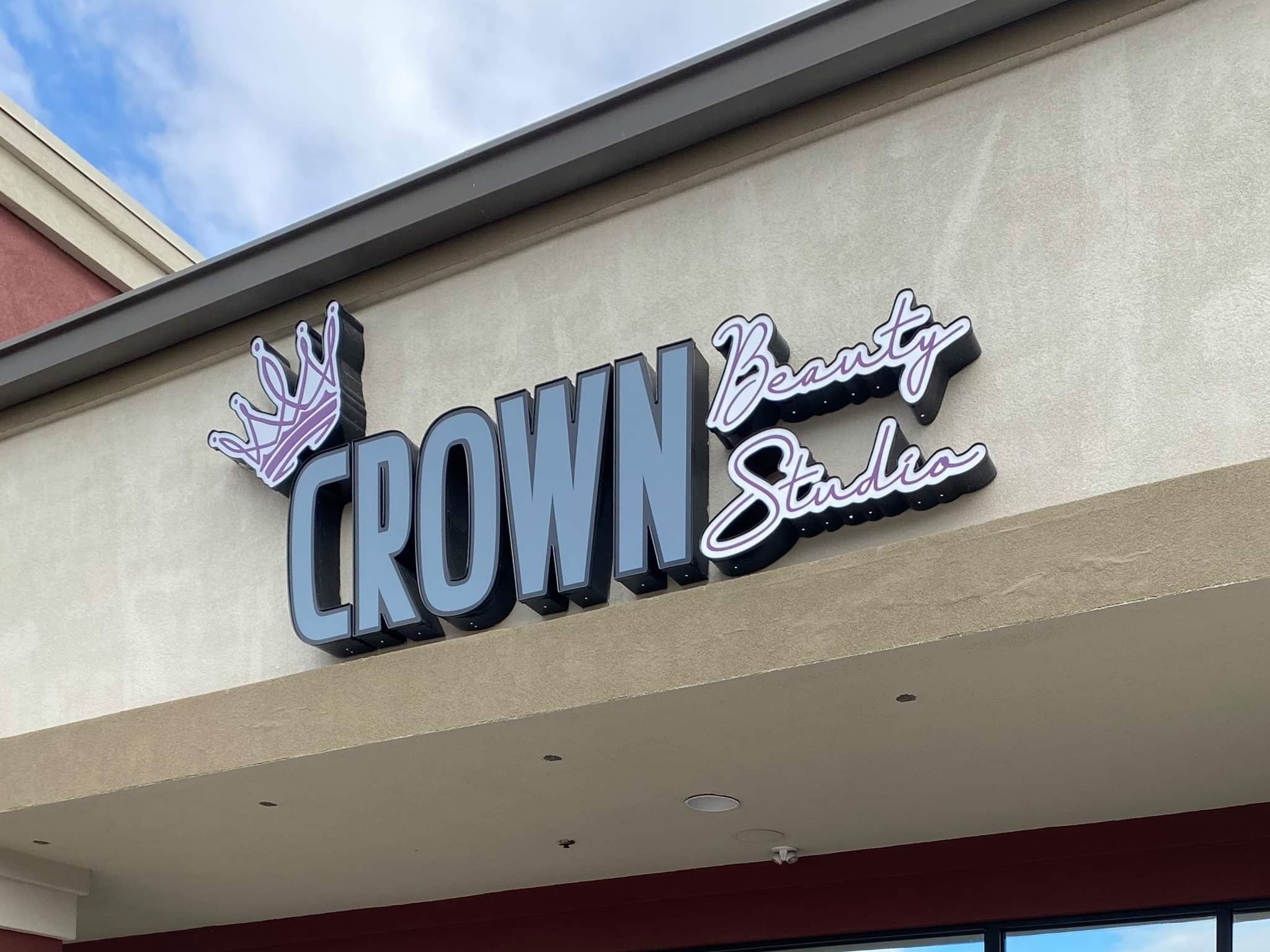 Crown Beauty studio Logo at the store front