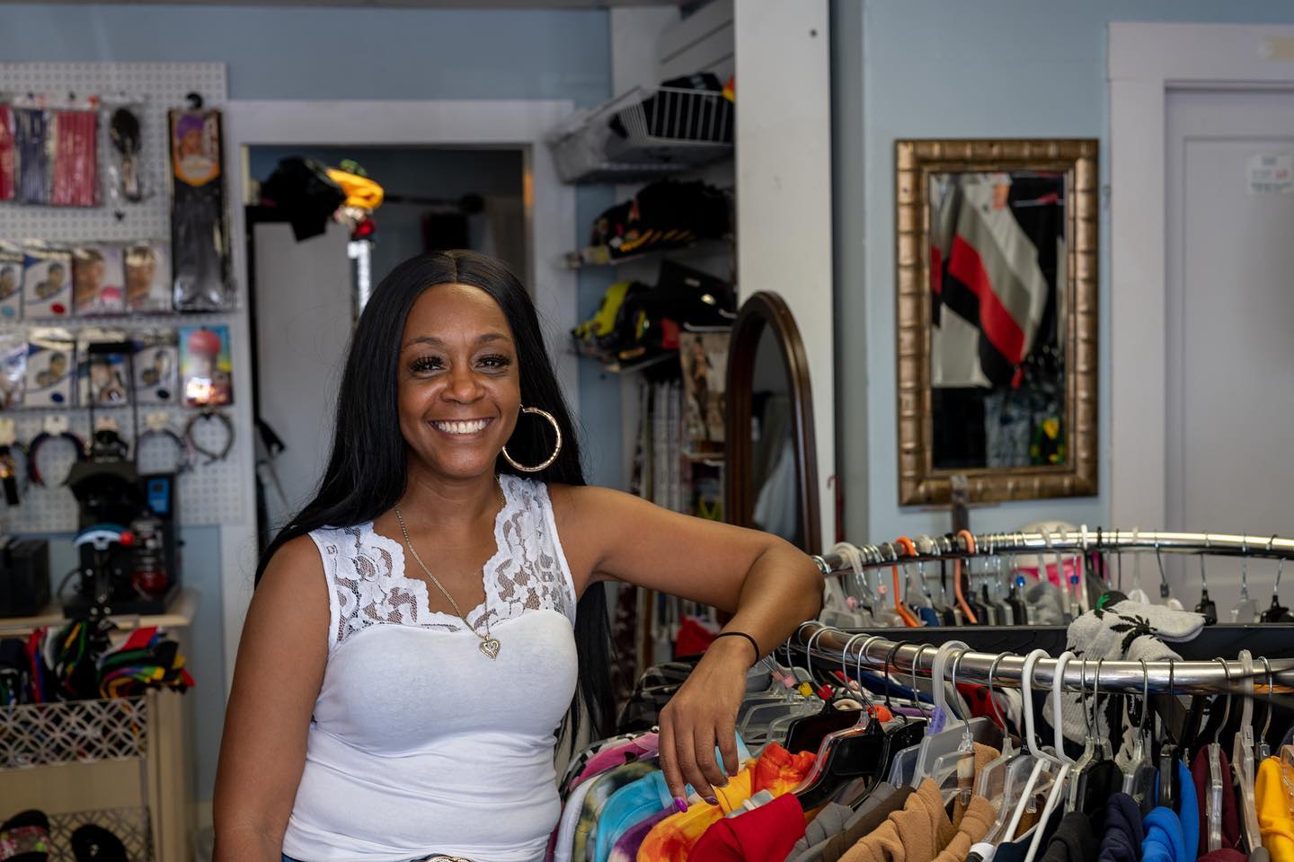 the owner of Stylz 4 Less inside her shop