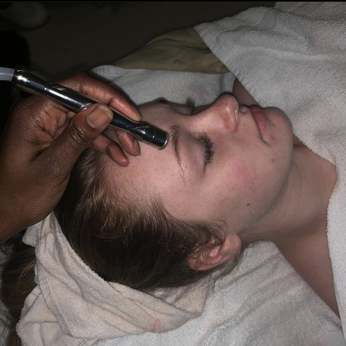 Zagon Beauty staff working on a client eye lash and brow