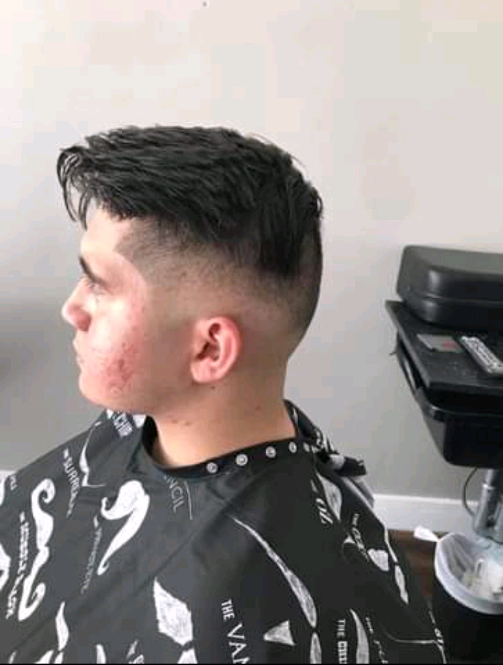 High fade style hair cut done at Millennium Kutz