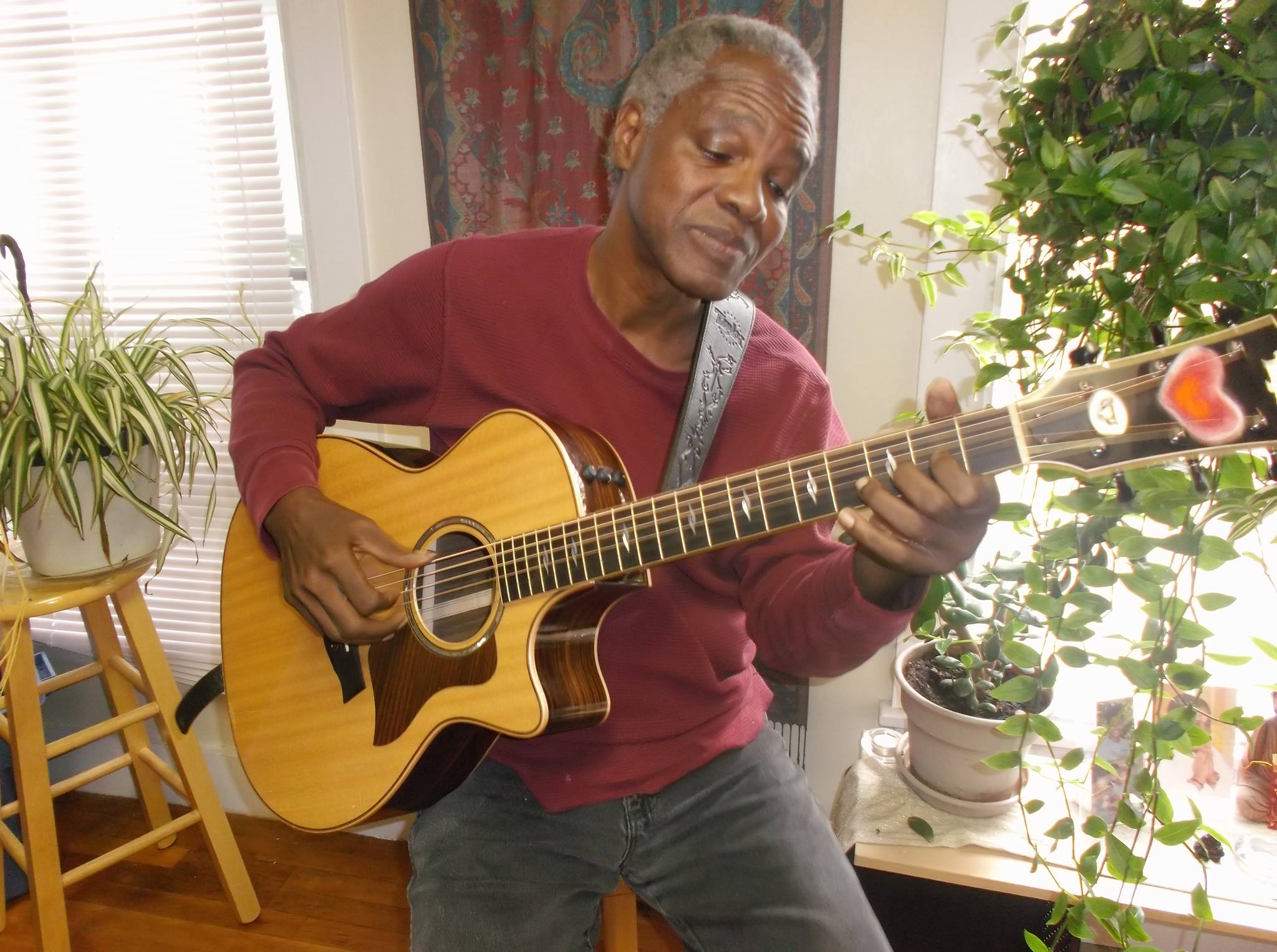 Picture of Rodney maschia the musician playing his guitar