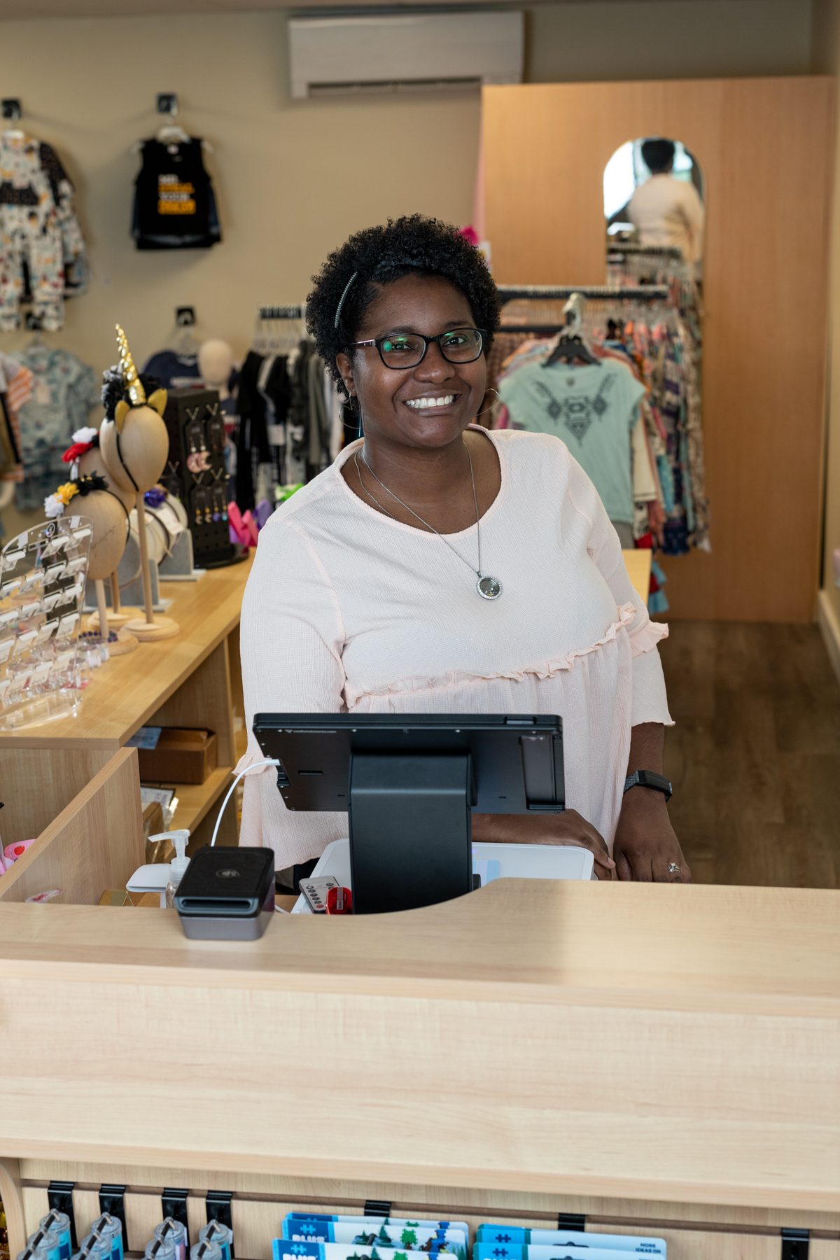 Business owner at the front desk of Klassically Kute Designs