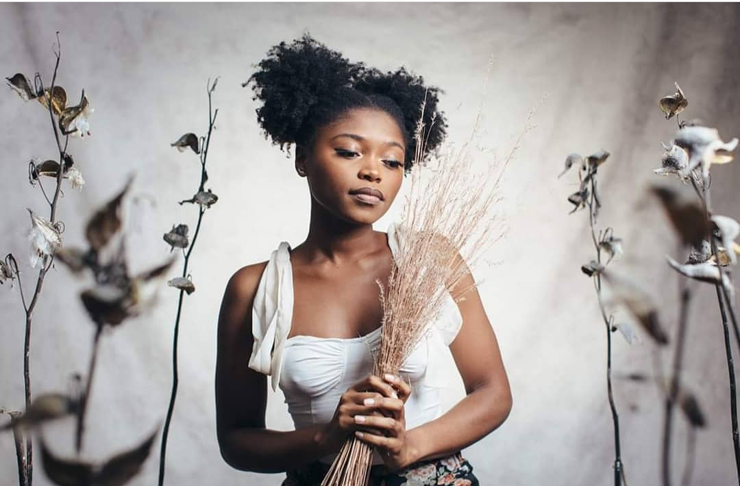 Angelikah Fahray holding a broom