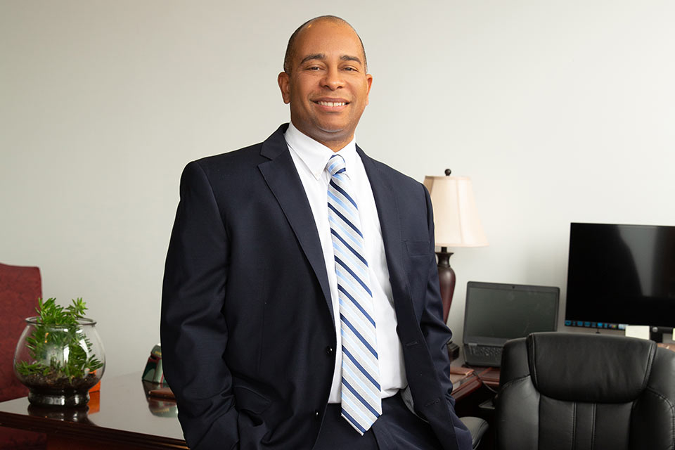 Thomas Douglas standing in a photo shoot in his office