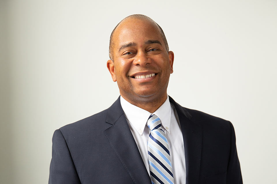 Thomas Douglas in a photo shoot wearing a blue suit